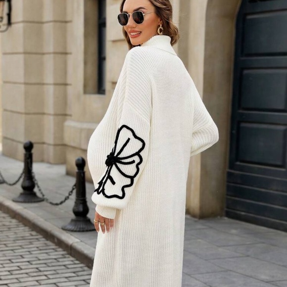 Elegant White Knit Dress with Black Floral Design - Picture 3 of 3